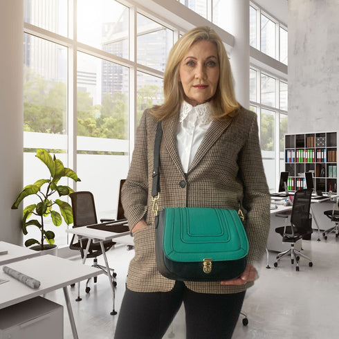 women holding black leather bag with interchangeable front flap